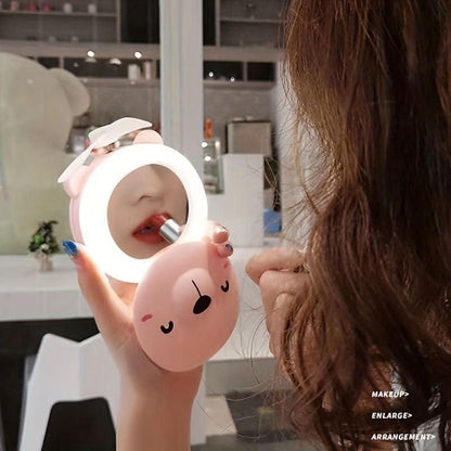 PiggyGlow™ Portable Fan Mirror – LED Makeup Mirror with Mini Cooling Fan